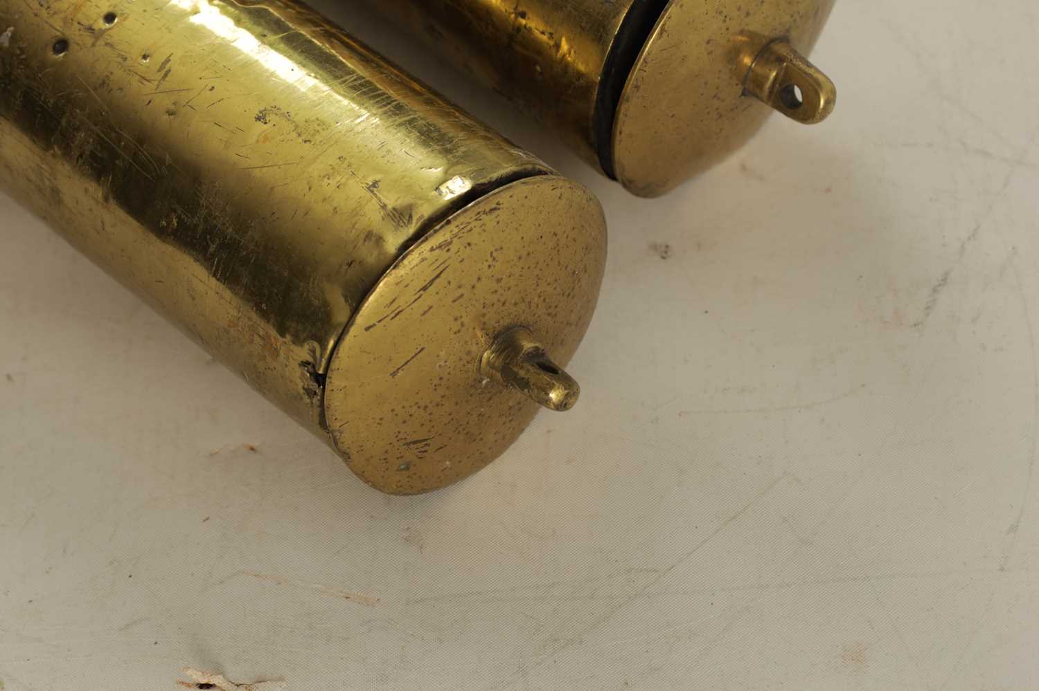 Lot 1059 A PAIR OF 18TH CENTURY BRASS CASED