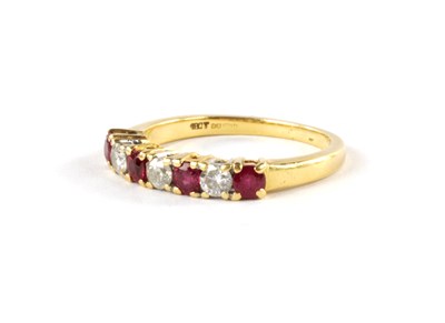 Lot 351 - AN 18CT YELLOW GOLD LADIES SEVEN STONE DIAMOND AND RUBY DRESS RING