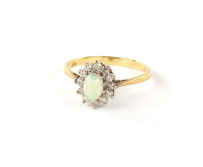 Lot 329 - A .750 HALLMARKED YELLOW GOLD OPAL AND DIAMOND DRESS RING