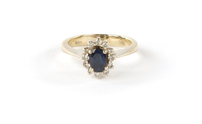 Lot 328 - AN 18K WHITE GOLD SAPPHIRE AND DIAMOND DRESS RING