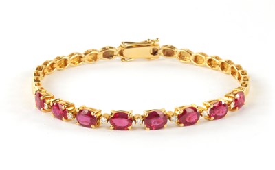 Lot 334 - A FINE .750 HALLMARKED YELLOW GOLD, RUBY AND DIAMOND SET BRACELET