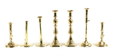 Lot 523 - A SELECTION OF EARLY 18TH CENTURY BRASS PUSH EJECT CANDELSTICKS