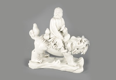 Lot 227 - A CHINESE BLANC-DE-CHINE PORCELAIN FIGURE