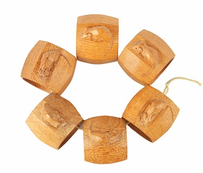 Lot 1107 - A GOOD SET OF SIX ROBERT 'MOUSEMAN' THOMPSON LIGHT OAK AND SLIGHTLY AZED SERVIETTE RINGS