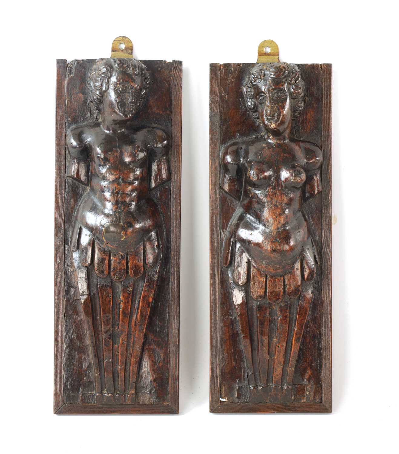 Lot 1131 - A PAIR OF 17TH CENTURY DUTCH CARVED WALNUT FIGURES