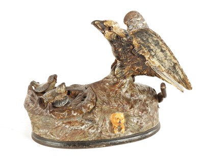 Lot 585 - A LATE 19TH CENTURY PAINTED CAST IRON MECHANICAL "EAGLE AND EAGLETS" MONEY BOX DESIGNED BY J & E STEVENS