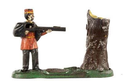 Lot 581 - A LATE 19TH CENTURY PAINTED CAST IRON MECHANICAL "GRENADIER" MONEY BOX