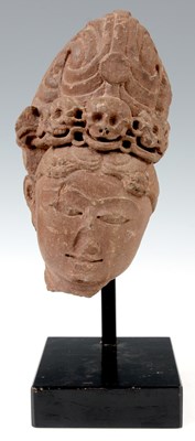 Lot 239 - AN EARLY CARVED STONE MASK HEAD with ornate...