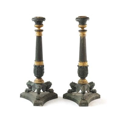 Lot 596 - A PAIR OF REGENCY-PATINATED METAL AND BRASS ORMOLU CANDLESTICKS