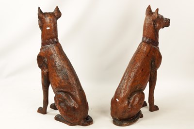 Lot 641 - A PAIR OF LIFE-SIZE BLACK FOREST STYLE CARVED WOOD SCULPTURES