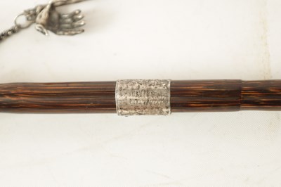 Lot 574 - AN UNUSUAL 19TH CENTURY SILVER TOPPED WALKING STICK WITH HINGED SKULL POMMEL