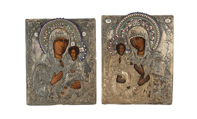 Lot 661 - TWO EARLY SILVERED METAL AND ENAMEL DECORATED RUSSIAN ICONS