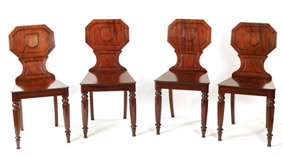 Lot 1265 - A SET OF FOUR MAHOGANY REGENCY HALL CHAIRS