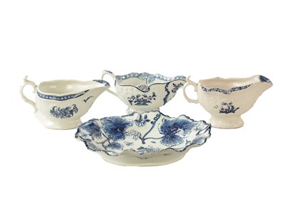 Lot 84 - AN 18TH CENTURY FIRST PERIOD WORCESTER SAUCE BOAT, A 18TH CENTURY ISLEWORTH, AND ONE OTHER 18TH CENTURY BLUE ND WHITE SAUCE BOATS AND RELIEF MOULDED DISH
