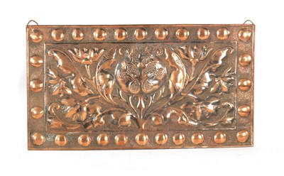 Lot 549 - AN ARTS AND CRAFTS PLANISHED COPPER AND EMBOSSED WALL PLAQUE