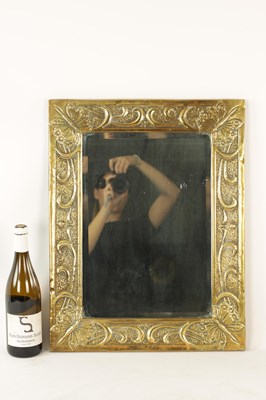 Lot 536 - A GLASGOW SCHOOL ARTS AND CRAFT PLANISHED BRASS HANGING MIRROR BY MARGARET GILMOUR