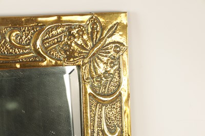 Lot 536 - A GLASGOW SCHOOL ARTS AND CRAFT PLANISHED BRASS HANGING MIRROR BY MARGARET GILMOUR