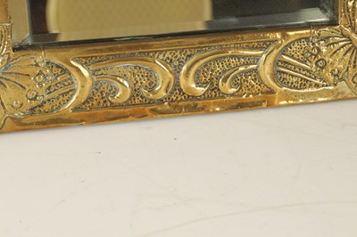Lot 536 - A GLASGOW SCHOOL ARTS AND CRAFT PLANISHED BRASS HANGING MIRROR BY MARGARET GILMOUR