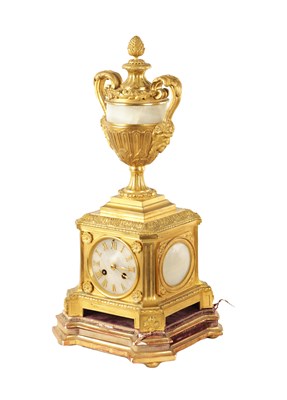 Lot 1065 - A 19TH CENTURY ORMOLU AND ONYX PANELLED MANTEL CLOCK