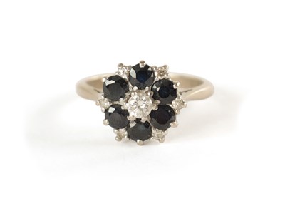 Lot 362 - AN 18CT WHITE GOLD DIAMOND AND SAPPHIRE RING