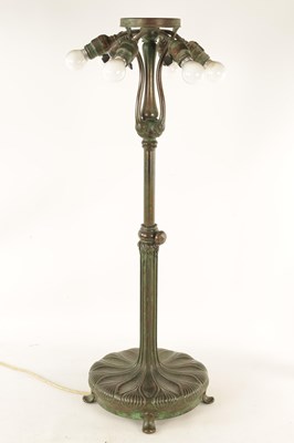 Lot 725 - TIFFANY & CO. NEW YORK. A LARGE STYLISH ART NOUVEAU GREEN PATINATED BRONZE TELESCOPIC AND STAINED GLASS TABLE LAMP