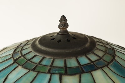 Lot 725 - TIFFANY & CO. NEW YORK. A LARGE STYLISH ART NOUVEAU GREEN PATINATED BRONZE TELESCOPIC AND STAINED GLASS TABLE LAMP