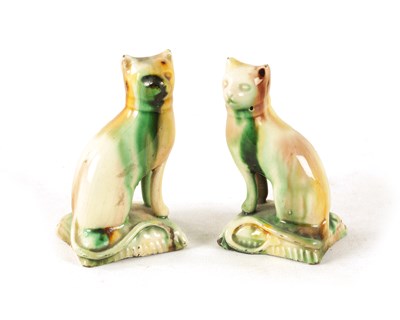 Lot 29 - A PAIR OF LATE 18TH CENTURY WHIELDON TYPE POTTERY CATS