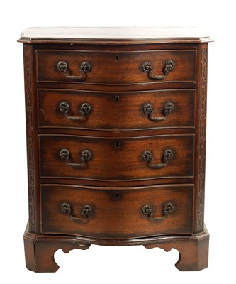 Lot 373 - A 20TH CENTURY SERPENTINE MAHOGANY CHEST OF DRAWERS