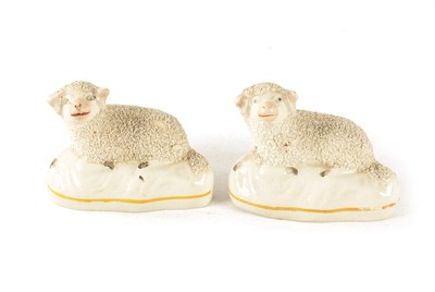 Lot 35 - TWO 19TH CENTURY STAFFORDSHIRE POTTERY SHEEP