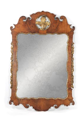 Lot 880 - A GEORGE I CARVED WALNUT AND PARCEL GILT HANGING MIRROR