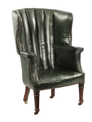 Lot 894 - A GEORGE III MAHOGANY AND GREEN LEATHER UPHOLSTERED BARREL BACK WING ARMCHAIR