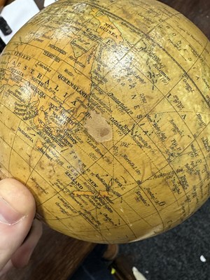 Lot 140 - AN EARLY 20TH CENTURY 6” TERRESTRIAL GLOBE ON STAND