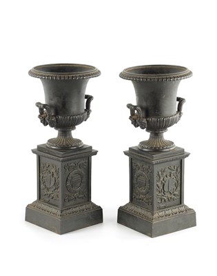 Lot 484 - A PAIR OF 19TH CENTURY CAST IRON MEDICI URNS ON PEDESTALS