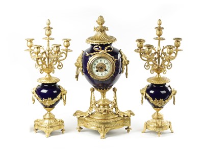 Lot 749 - A LATE 19TH CENTURY FRENCH THREE PIECE BLUE PORCELAIN AND GILT METAL CLOCK GARNITURE