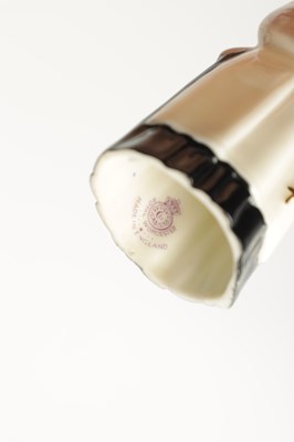 Lot 473 - A ROYAL WORCESTER PORCELAIN CANDLE SNUFFER