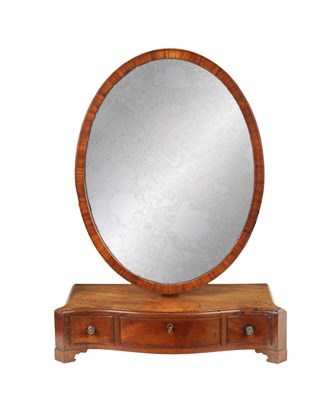 Lot 1019 - A GEORGE III FIGURED MAHOGANY DRESSING TABLE MIRROR OF A DESIGN BY GILLOW