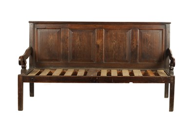 Lot 343 - AN 18TH CENTURY JOINED OAK SETTLE WITH PANELLED BACK AND SCROLLED SIDE ARMS ON TAPERING LEGS