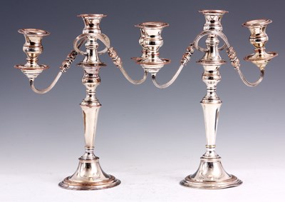 Lot 112 - A PAIR OF 19TH CENTURY SILVER PLATE ON COPPER ORNATE THREE BRANCH CANDELABRA WITH TAPERING COLLARED STEMS AND CIRCULAR BASES