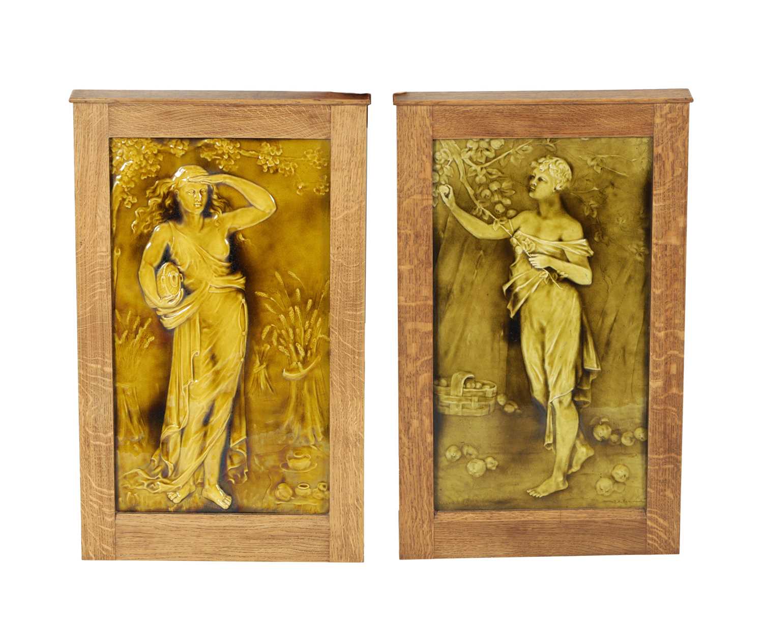 Lot 46 - A MATCHED PAIR OF EARLY 20TH CENTURY BURMANTOFTS GREEN GLAZED HANGING PLAQUES BY J. T. HAMMONDS.