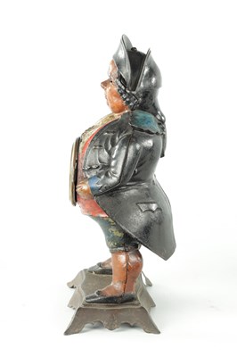 Lot 1370 - AN AMERICAN POLYCHROME PAINTED CAST IRON FIGURAL BLINKING EYE "CONTINENTAL MODEL" MANTEL TIMEPIECE
