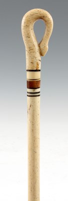 Lot 359 - A 19th CENTURY CARVED WHALEBONE WALKING CANE...