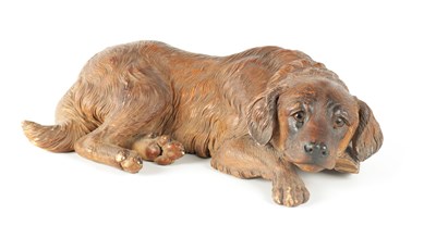 Lot 371 - A 19TH CENTURY BLACK FOREST CARVED LINDEN WOOD FIGURE OF A RECUMBENT DOG