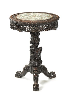Lot 112 - A FINE 19TH CENTURY CHINESE PROFUSELY CARVED CENTRE TABLE WITH CANTONESE PORCELAIN INSET TOP