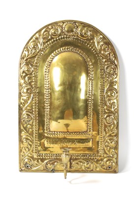 Lot 394 - AN 18TH CENTURY PRESSED BRASS WALL SCONCE