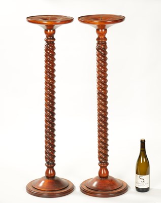 Lot 930 - A PAIR OF TWISTED FRUITWOOD CANDLE HOLDERS