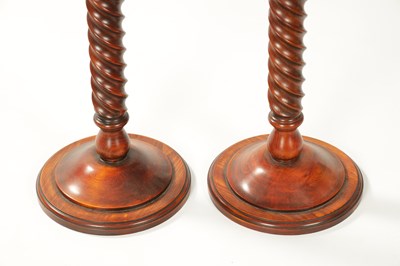 Lot 930 - A PAIR OF TWISTED FRUITWOOD CANDLE HOLDERS