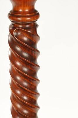 Lot 930 - A PAIR OF TWISTED FRUITWOOD CANDLE HOLDERS