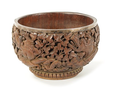 Lot 84 - A LATE 19TH CENTURY BURMESE CARVED HARDWOOD SILVER MOUNTED BOWL