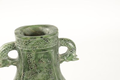 Lot 98 - A LARGE CHINESE SPINACH-GREEN JADE TWO-HANDLED VASE