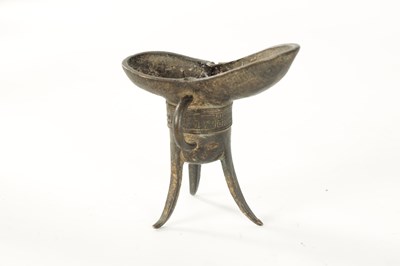 Lot 127 - AN EARLY CHINESE BRONZE ARCHAISTIC WINE VESSEL 'JUE'